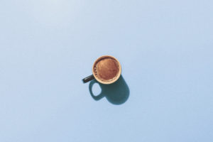 A cup of coffee on a blue background